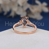 1.2ct Pear Cut Simulated Morganite Accented Trilogy Ring 14k Rose Gold Plated