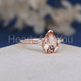1.2ct Pear Cut Simulated Morganite Accented Trilogy Ring 14k Rose Gold Plated
