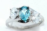 2.45ct Oval Cut Blue Topaz Swirl Trilogy Engagement Ring 18k White Gold Finish