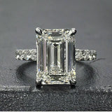 4Ct Emerald Cut Diamond Solitaire Ring 14K White Gold Finish with Round Accents