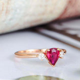 1ct Pear Cut Pink Ruby Engagement Ring Round Accents Trilogy 14k RoseGold Finish