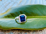 2.6ct Emerald Cut Blue Emerald Bezel Set Solitaire Ring 14k White Gold Finish