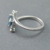 1.2ct Oval Cut London Blue Topaz Swirl Solitaire Trilogy Ring 14k WhiteGold Over