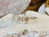2.3ct Emerald Cut Simulated Diamond Three Stone Ring 14k White Gold Plated