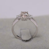 2.1ct Oval Cut Morganite Solitaire with Accent Trilogy Ring 14k White Gold Over