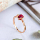 1ct Pear Cut Pink Ruby Engagement Ring Round Accents Trilogy 14k RoseGold Finish