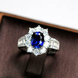2ct Oval Cut Blue Sapphire Floral Halo Baguette Accent Ring 14k Rose Gold Finish