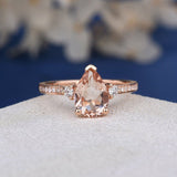 1.2ct Pear Cut Simulated Morganite Accented Trilogy Ring 14k Rose Gold Plated
