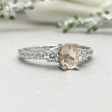 2ct Oval Cut Morganite Solitaire with Accent Trilogy Ring 14k White Gold Finish