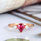 1ct Pear Cut Pink Ruby Engagement Ring Round Accents Trilogy 14k RoseGold Finish