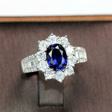 2ct Oval Cut Blue Sapphire Floral Halo Baguette Accent Ring 14k Rose Gold Finish