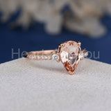 1.2ct Pear Cut Simulated Morganite Accented Trilogy Ring 14k Rose Gold Plated